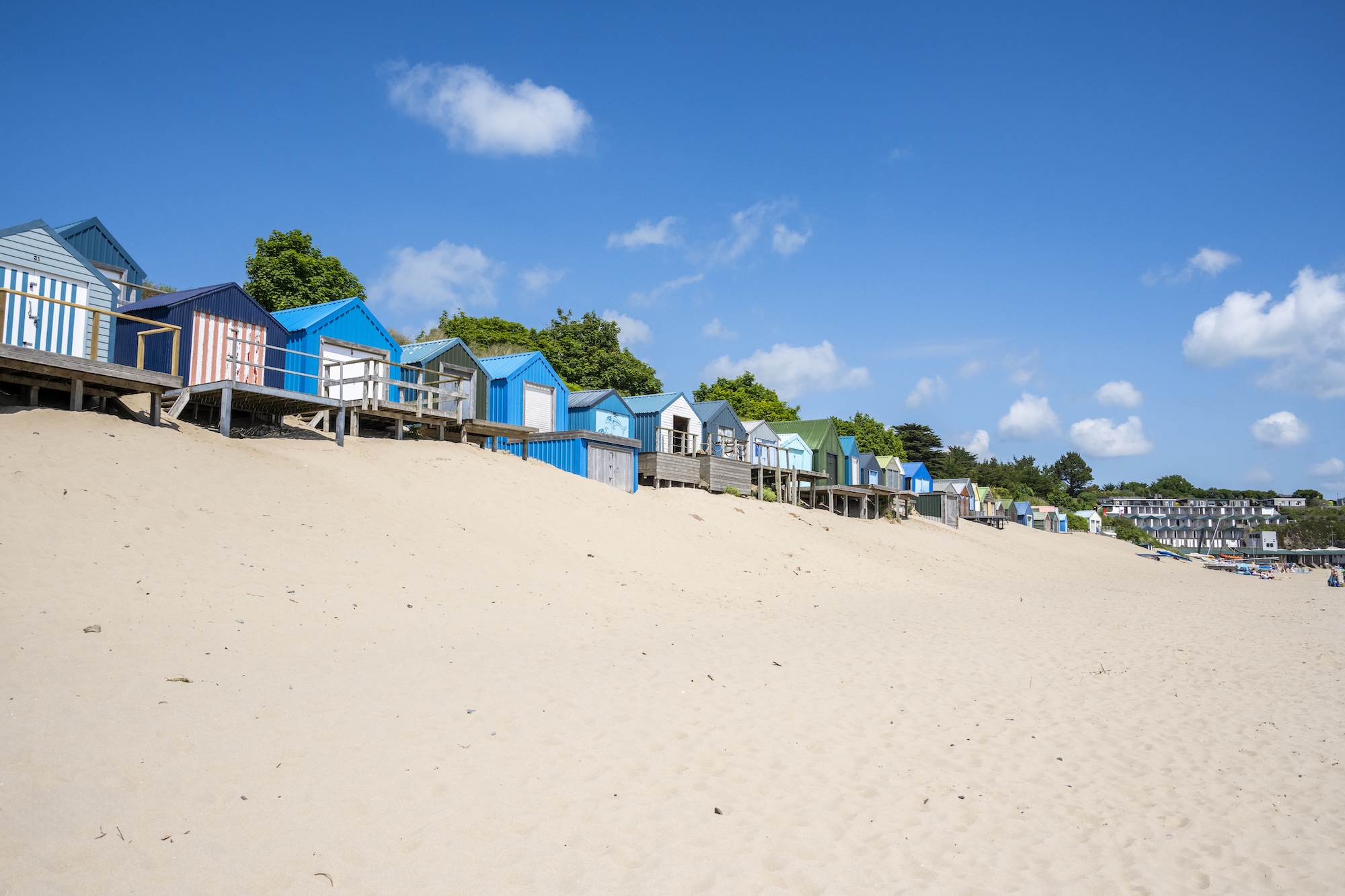 Colourful beach huts on the sandy beach at Abersoch, North Wales