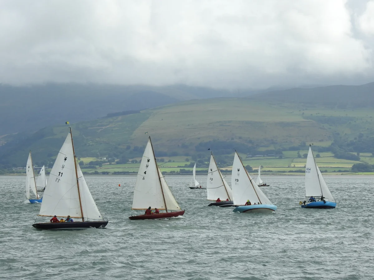 A row of sailboats in the Menai Strait, North Wales. July & August events North Wales
