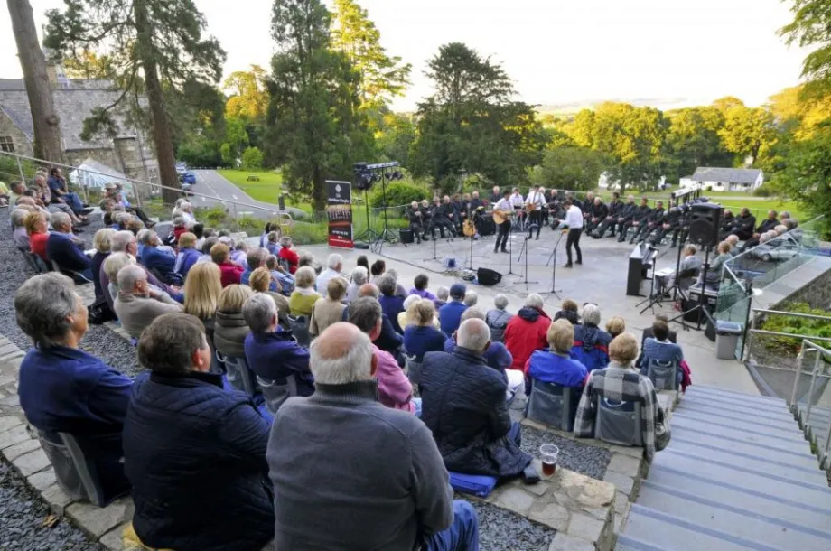 Spectators at the outdoor theatre at Plas Glyn y weddw Llanbedrog