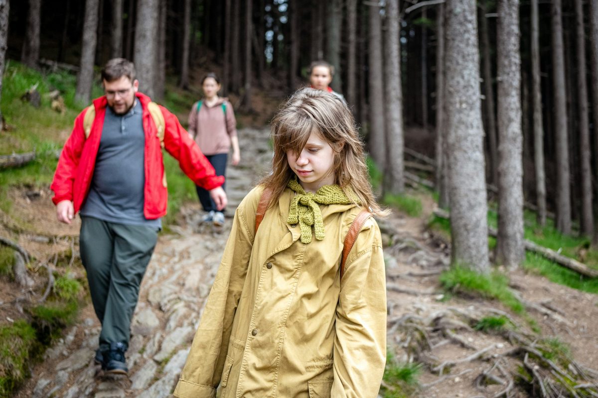 A family walking through the woods. Best forests for kids North Wales.