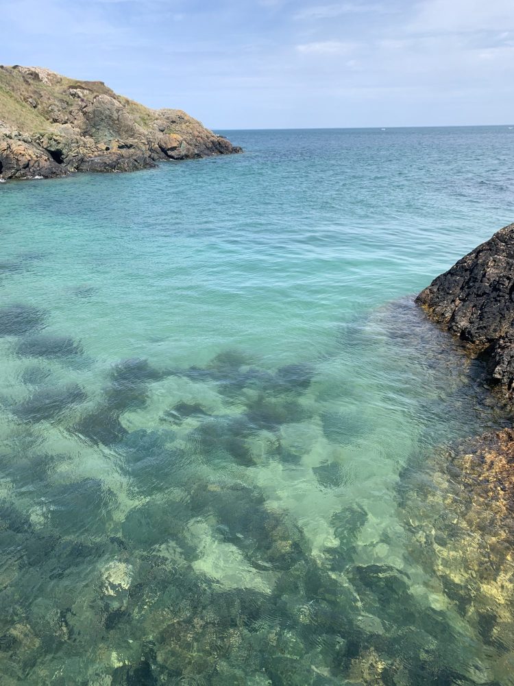 The waters of Porthdinllaen, one of our favourite places for sea swimming in North Wales