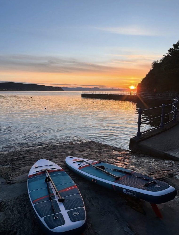 Image from Abersoch Watersports - two paddleboards at sunrise on abersoch marina