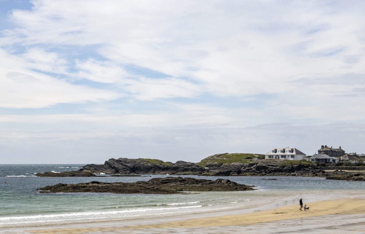 the view from Oyster holiday cottage Rockside overlooking Trearddur Bay beach - one of the best spots for sea swimming in North Wales