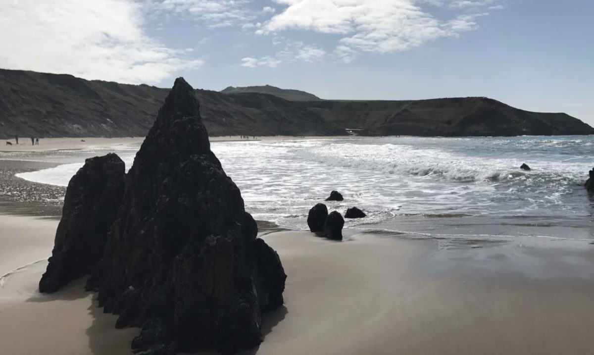 A view of the rocks at Porthor - a sheltered sea swimming spot on the Llyn Peninsula, North Wales