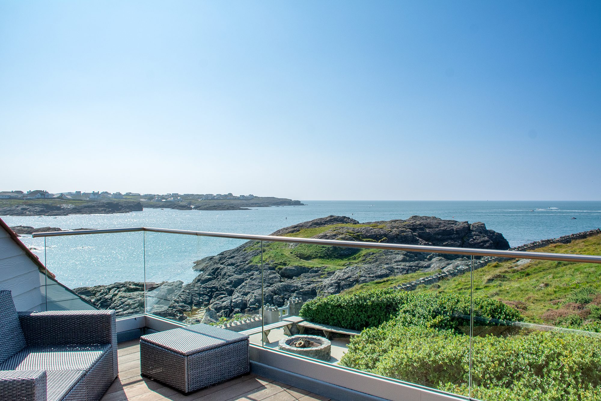 Views across the sea and Trearddur Bay from the glass balcony at Rockside holiday cottage on the headland of Trearddur Bay, Anglesey