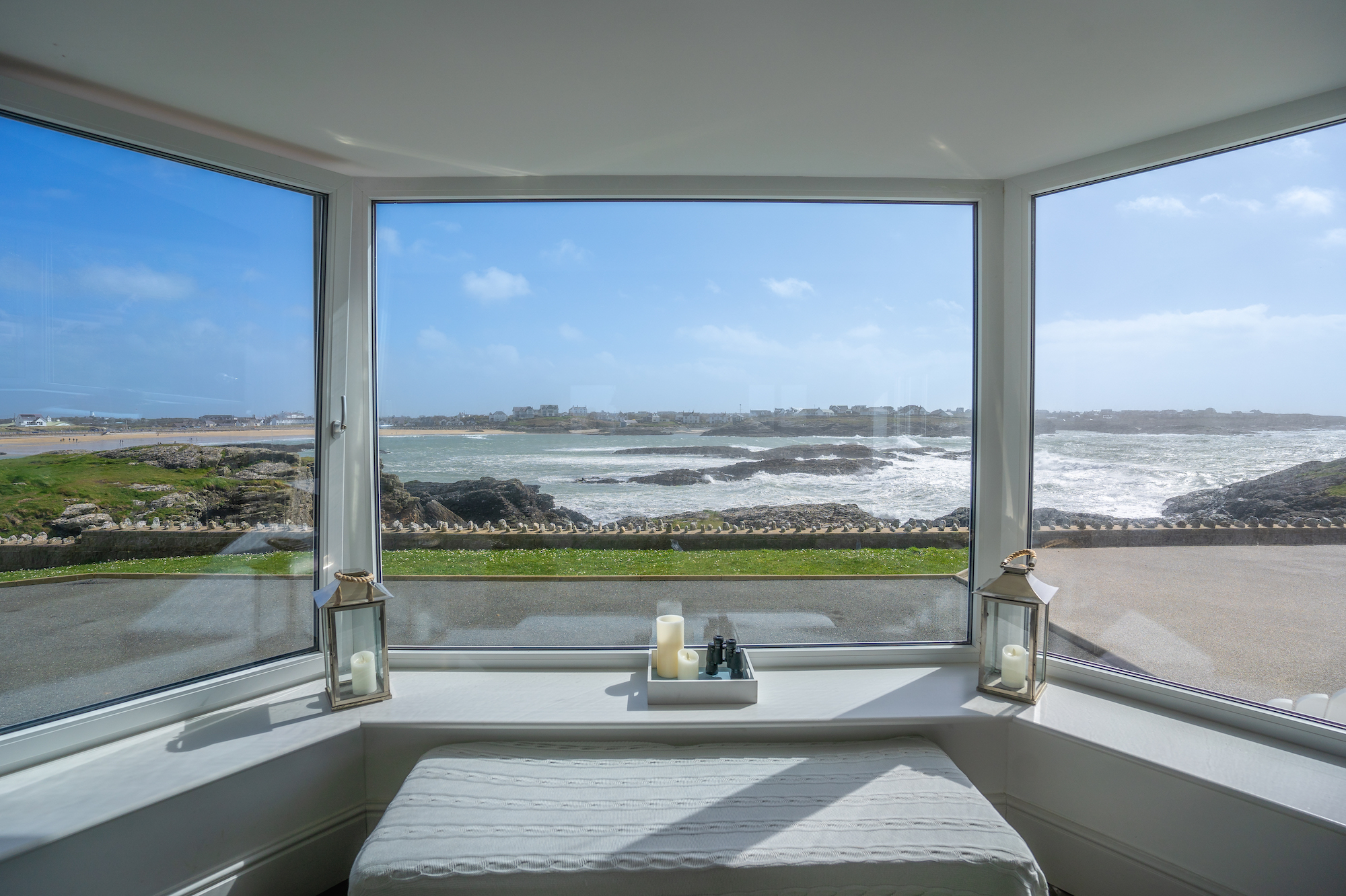 Sea views through the window of Rockside holiday cottage on the headland at Trearddur Bay, Anglesey