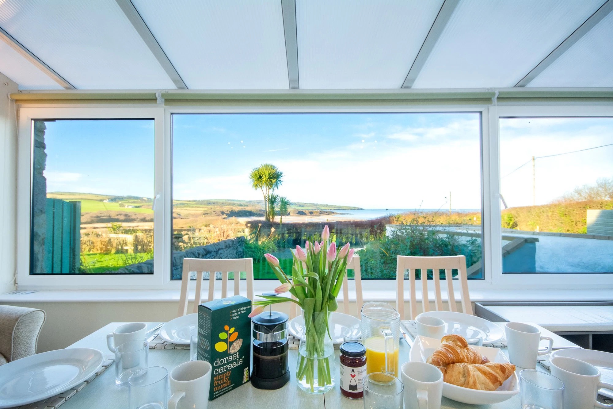 Breakfast with sea view of Lligwy Bay from dining room window at Lligwy View holiday Cottage in Lligwy near Moelfre, Anglesey