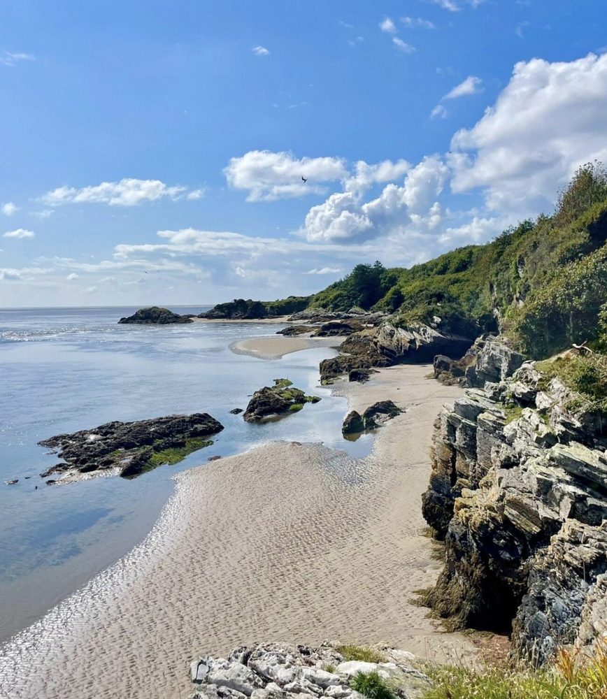 Golden sands and rock pools at Borth-y-Gest beach near Porthmadog.