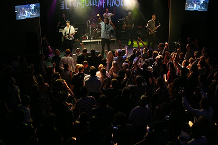 A crowd stood before a stage in the Llangollen Fringe Festival, North Wales