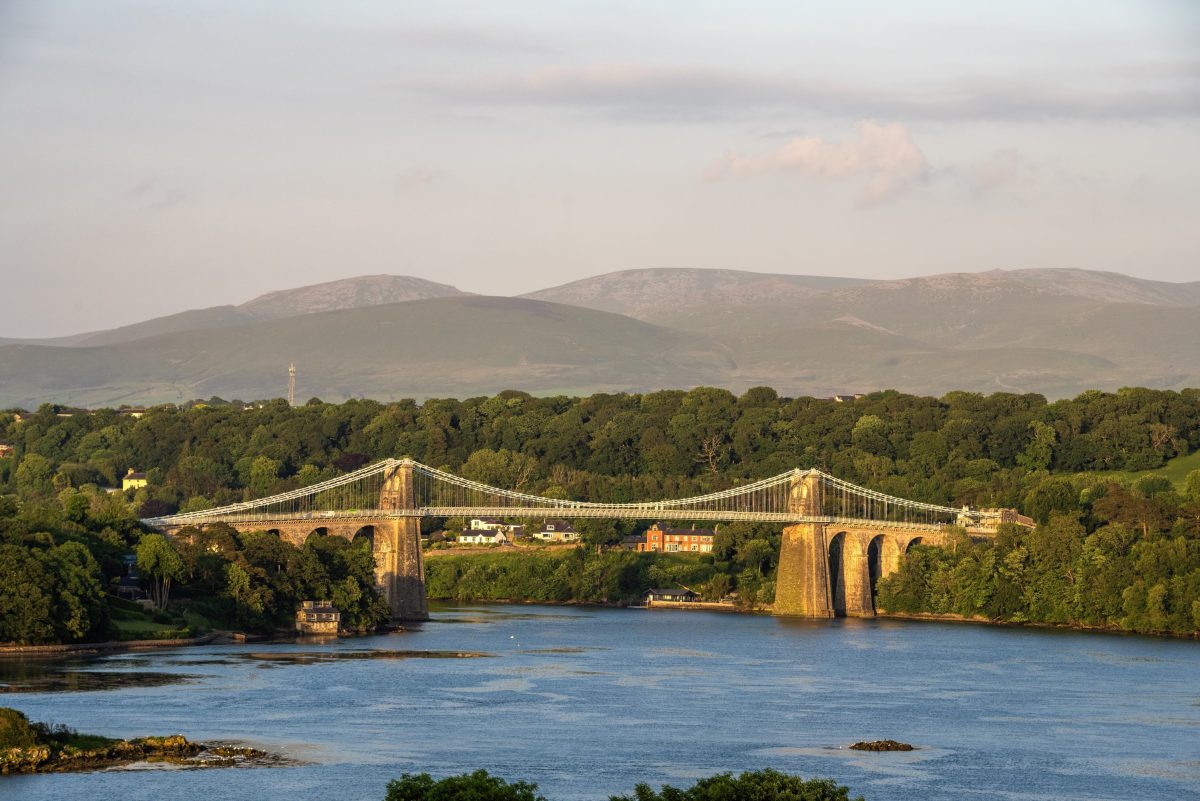 A wide view of the impressive Menai Suspension Bridge connecting Anglesey with the mainland 
