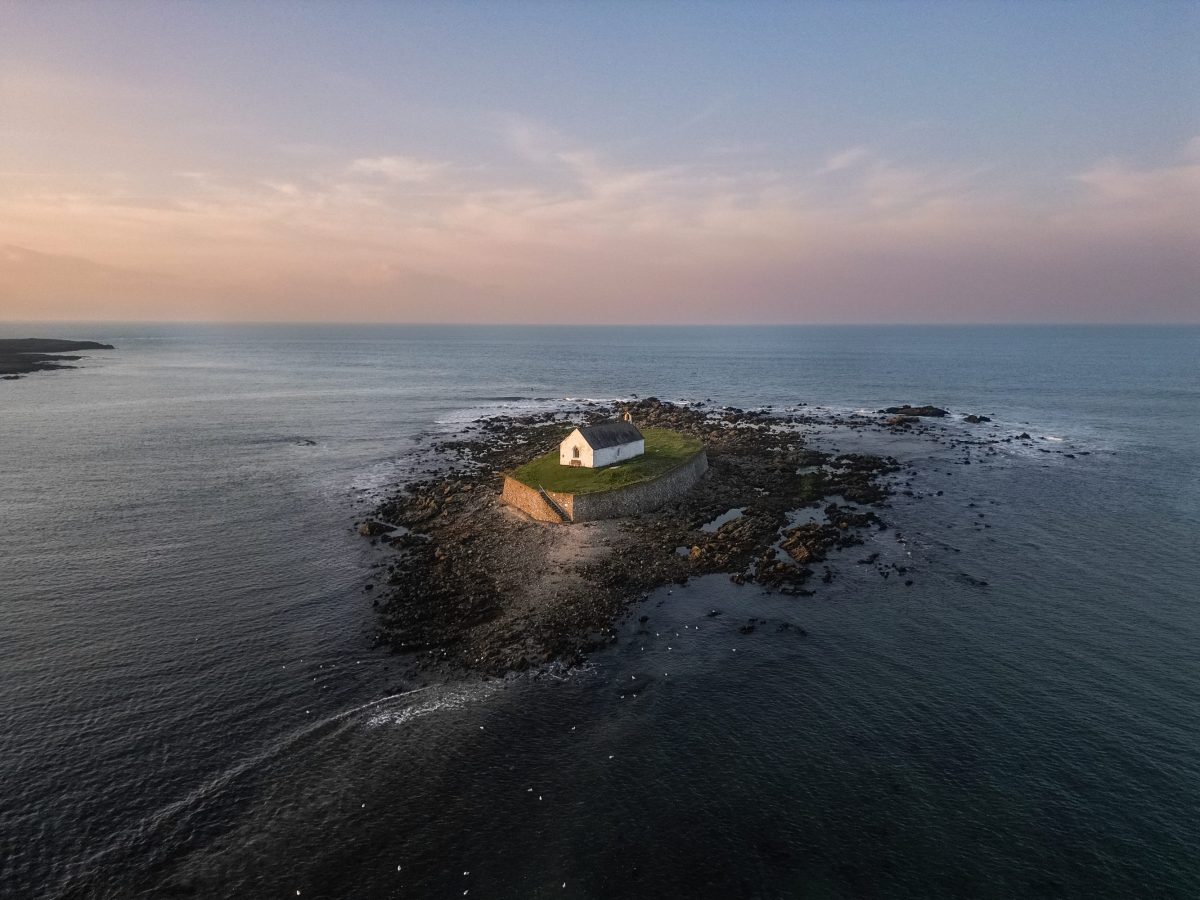 An aerial drone image of the Church in the sea, Eglwys Cwyfan, Anglesey 