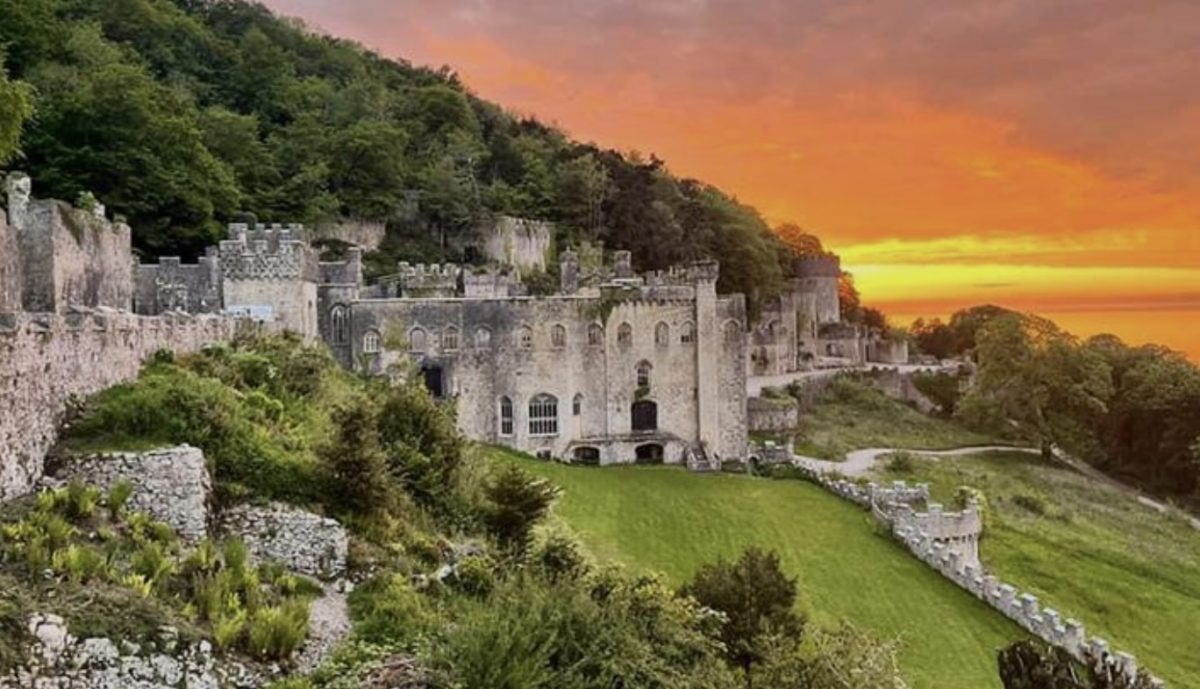 A stunning orange sunset beside Gwrych Castle, North Wales
