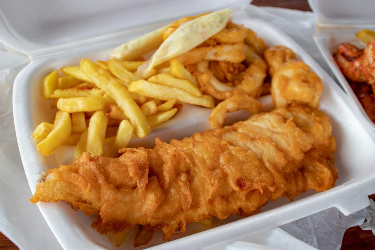 An open carton of fresh fish & chips