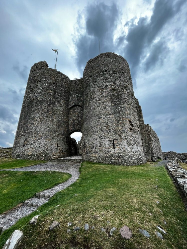 Criccieth Castle overlooking Tremadog Bay on a moody autumn day.