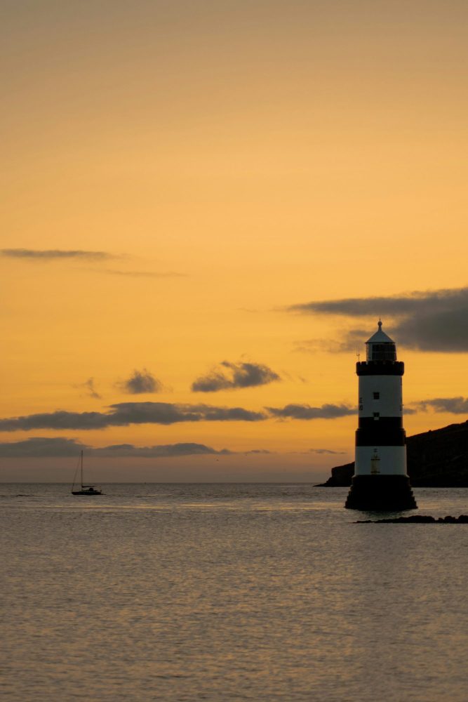 A view of Anglesey's Penmon point lighthouse after sunset