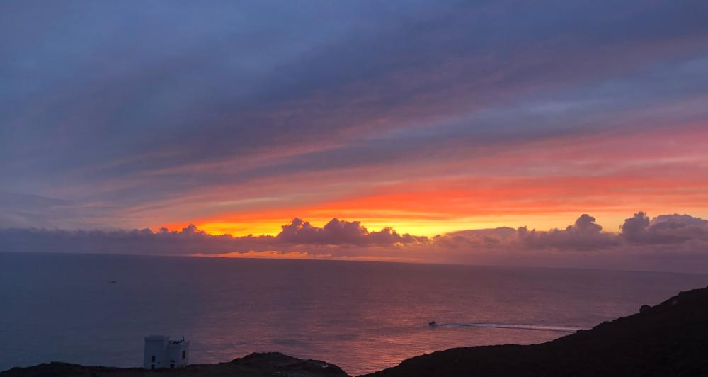 Anglesey's south stack lighthouse and RSPB reserve pictured at sunset 